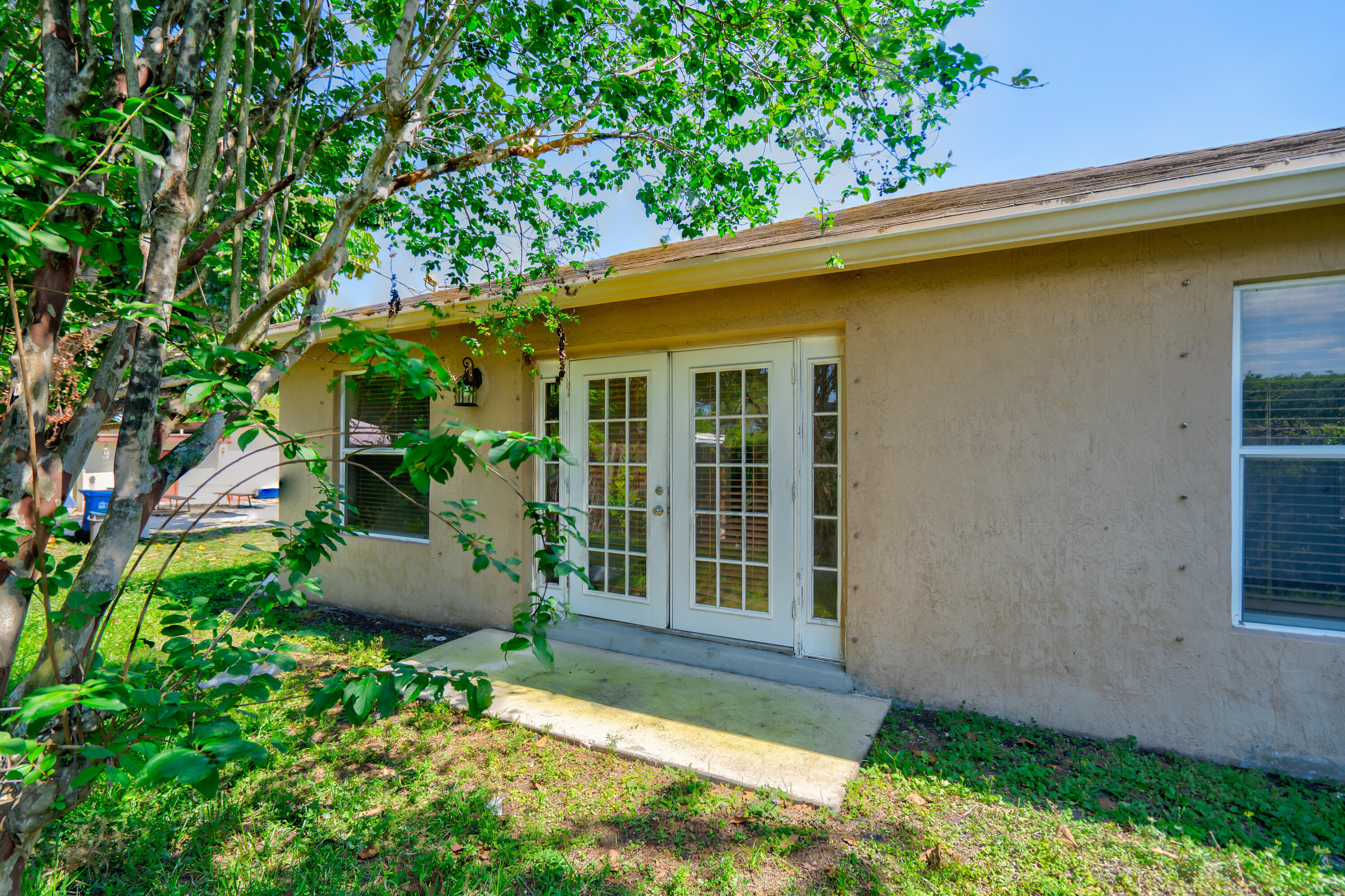 2241 Northwest 3rd Street Pompano Beach, FL 33069 - Photo 14 of 27 a house with a tree in front of it