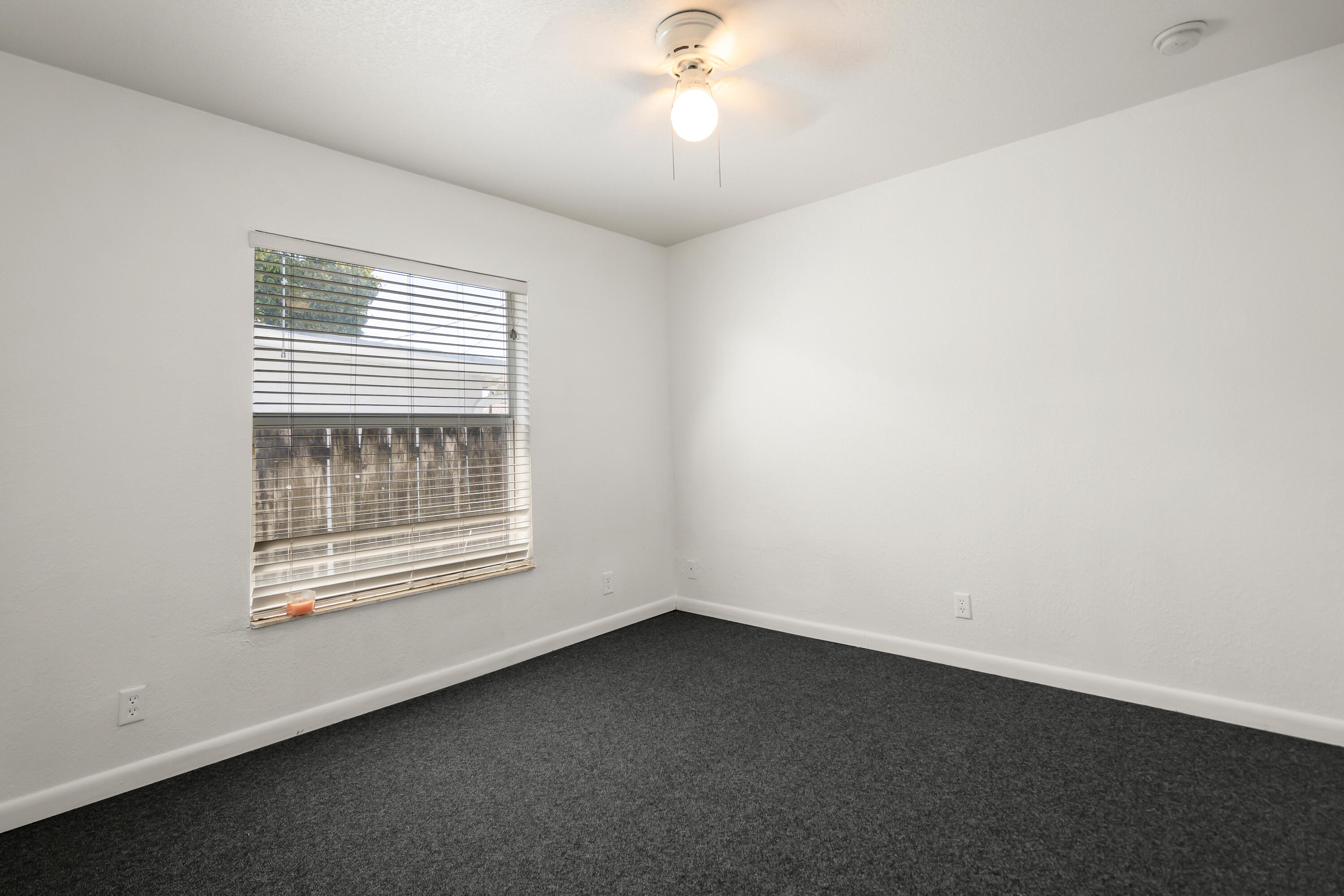2241 Northwest 3rd Street Pompano Beach, FL 33069 - Photo 25 of 27 an empty room with a window