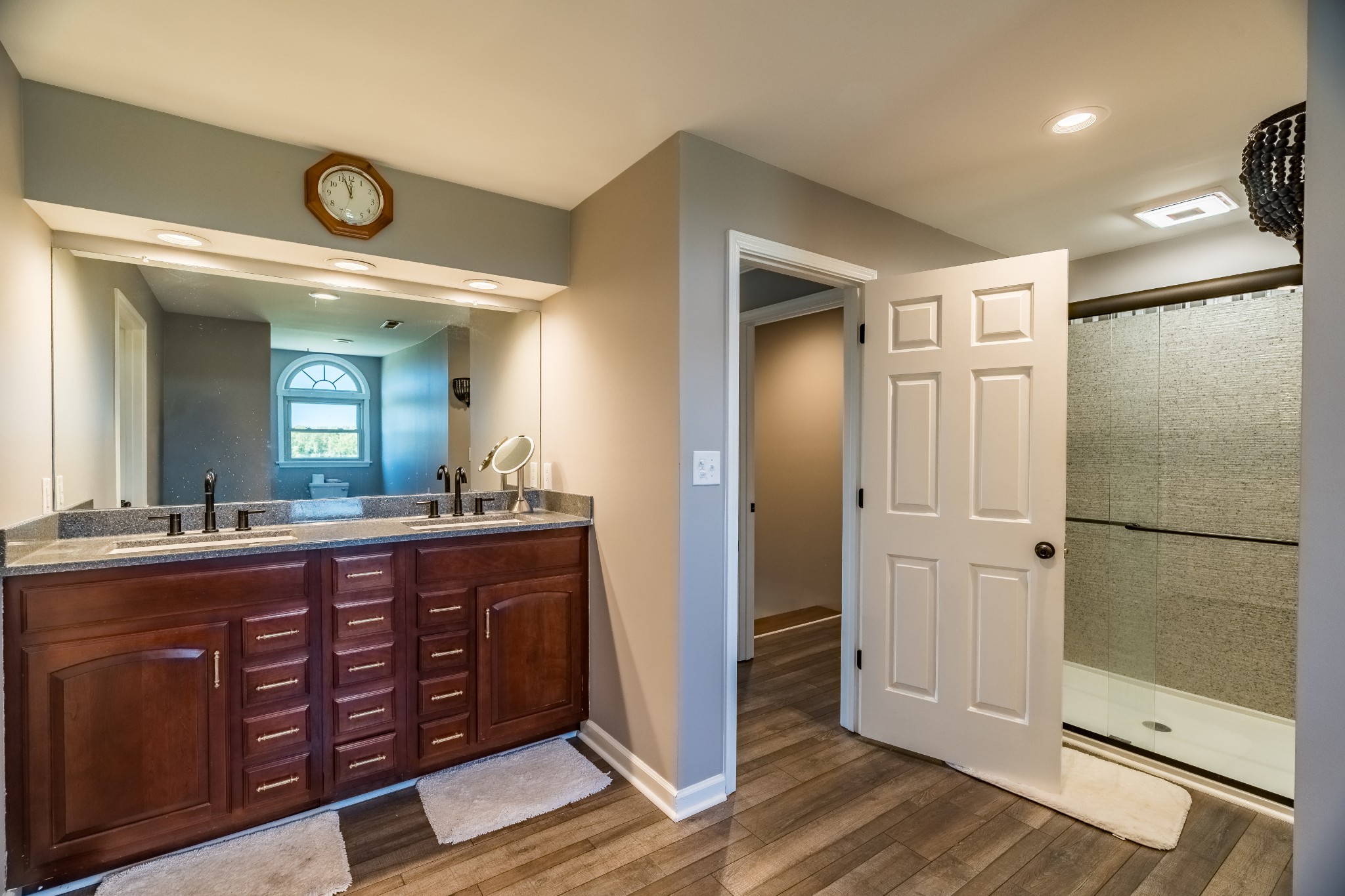 7135 Harmony Grove Road Crofton, KY 42217 - Photo 14 of 37 a spacious bathroom with a double vanity sink and a mirror