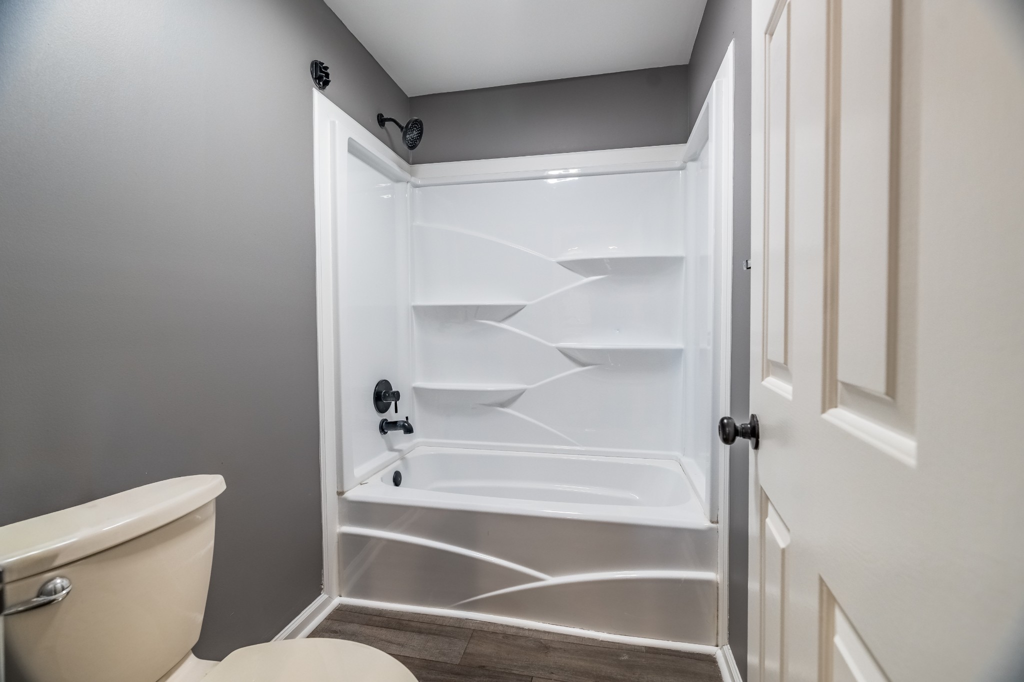 7135 Harmony Grove Road Crofton, KY 42217 - Photo 17 of 37 a bathroom with a toilet and a shower