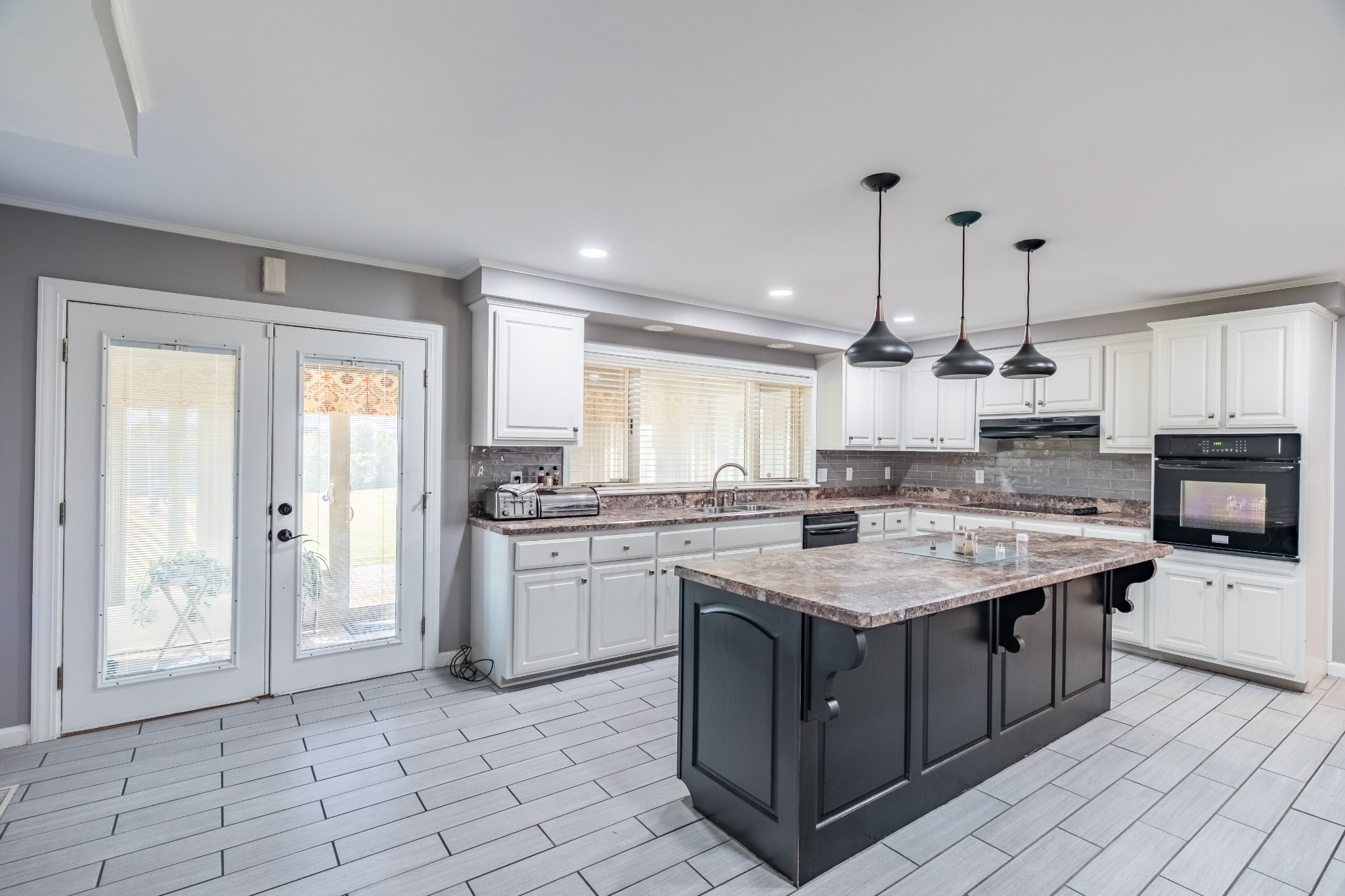 7135 Harmony Grove Road Crofton, KY 42217 - Photo 19 of 37 a kitchen with a sink stove and cabinets