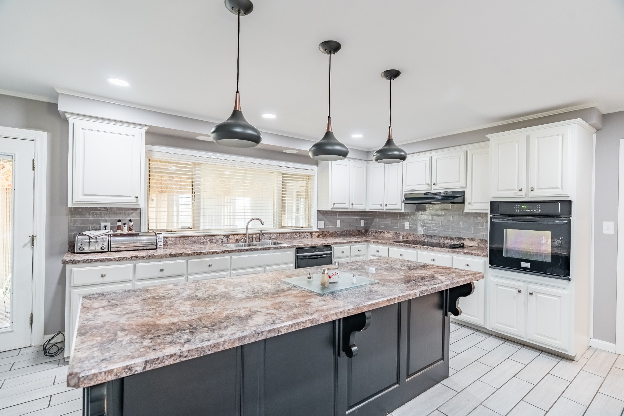 7135 Harmony Grove Road Crofton, KY 42217 - Photo 21 of 37 a kitchen with stainless steel appliances granite countertop a sink a stove and cabinets