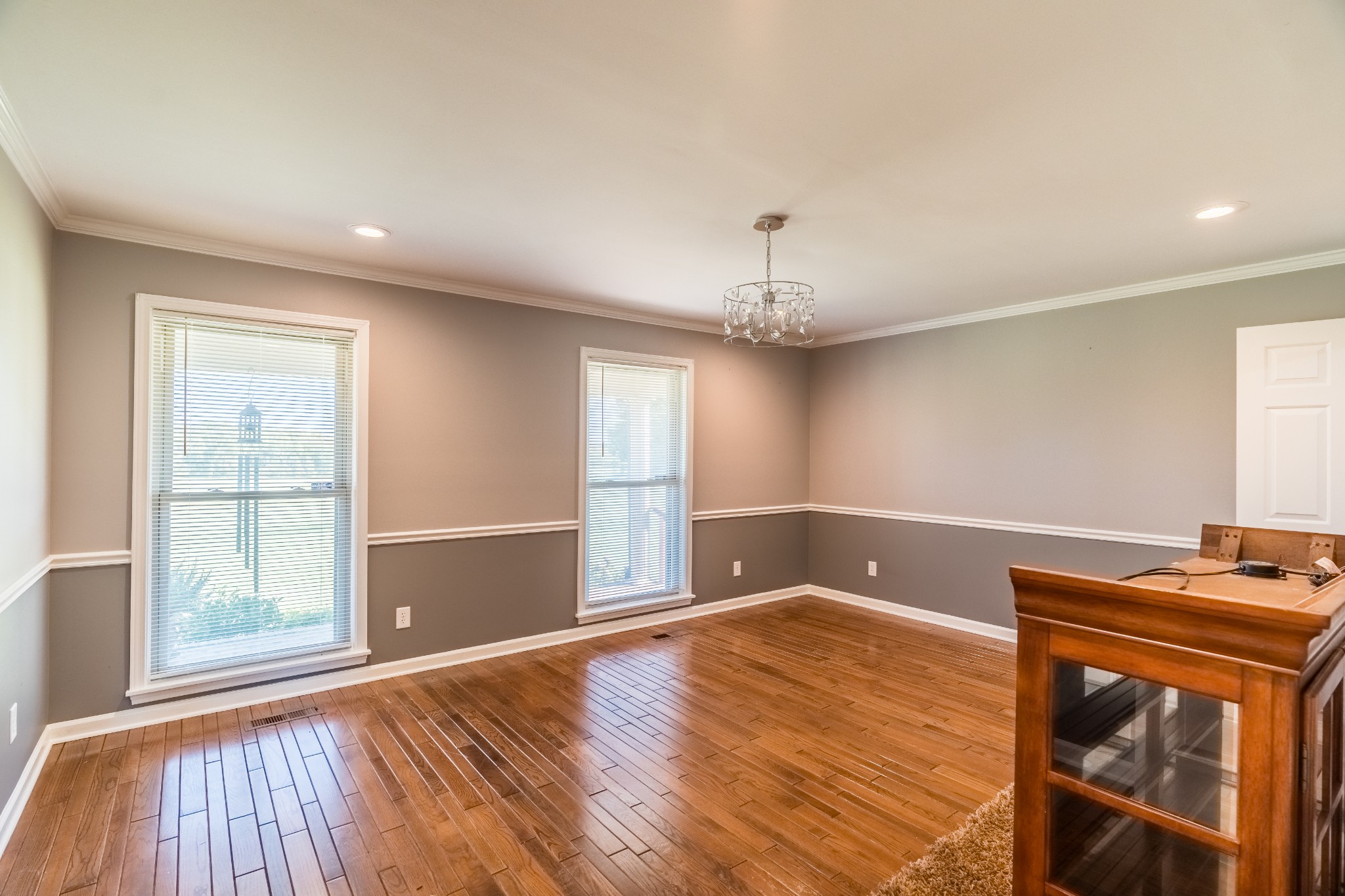 7135 Harmony Grove Road Crofton, KY 42217 - Photo 9 of 37 a view of empty room with wooden floor and fan