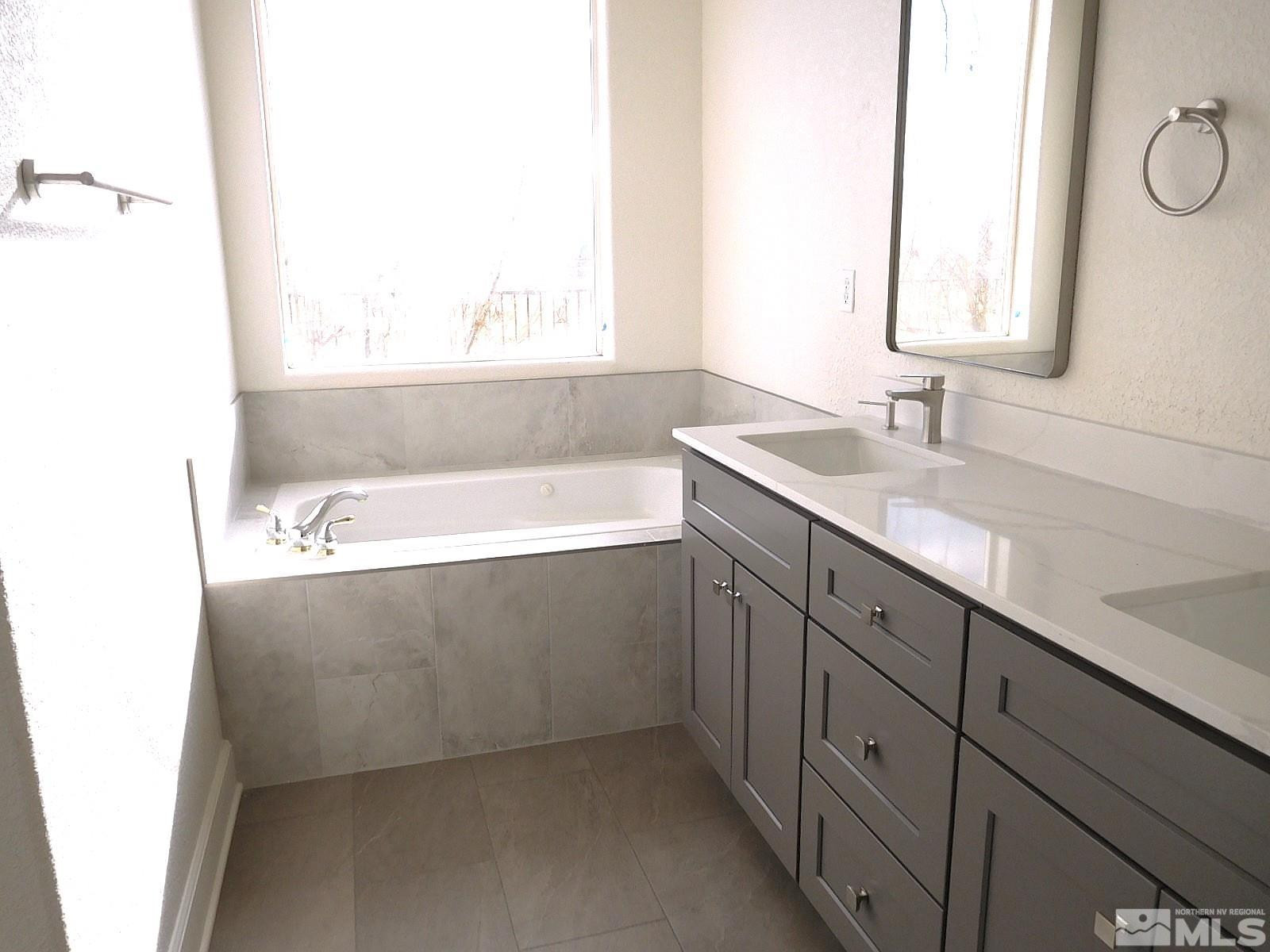 3463 Long Drive Minden, NV 89423 - Photo 12 of 36 a bathroom with a bathtub and a sink
