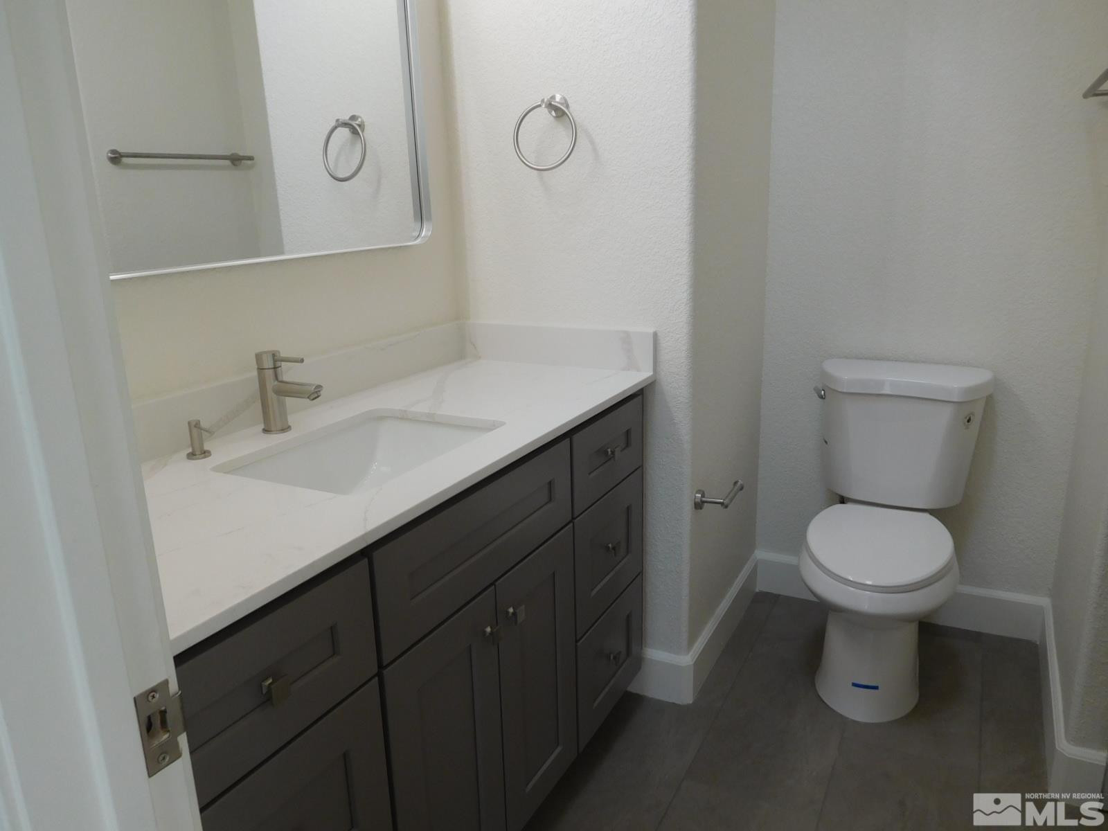 3463 Long Drive Minden, NV 89423 - Photo 16 of 36 a bathroom with a sink vanity and toilet