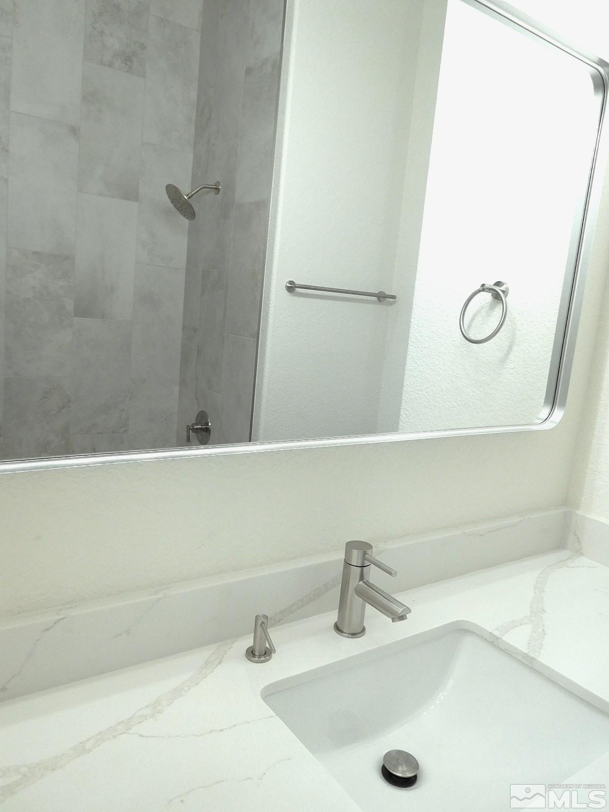 3463 Long Drive Minden, NV 89423 - Photo 17 of 36 a bathroom with a sink and a tub