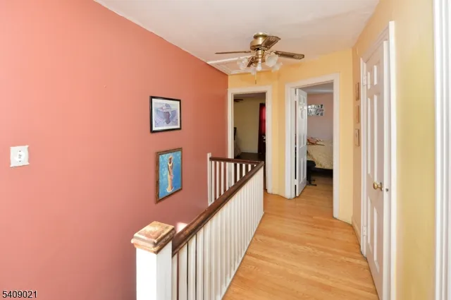 a view of a hallway with a dining area