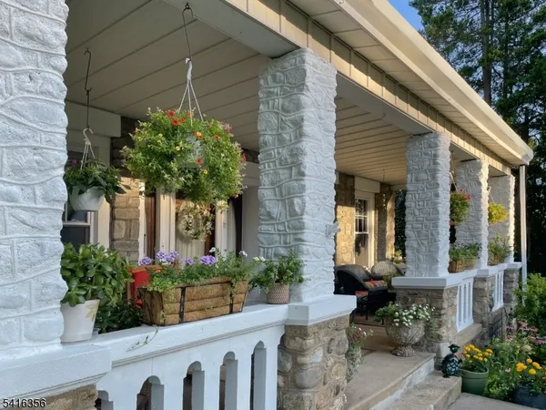 a view of a house with a garden and plants