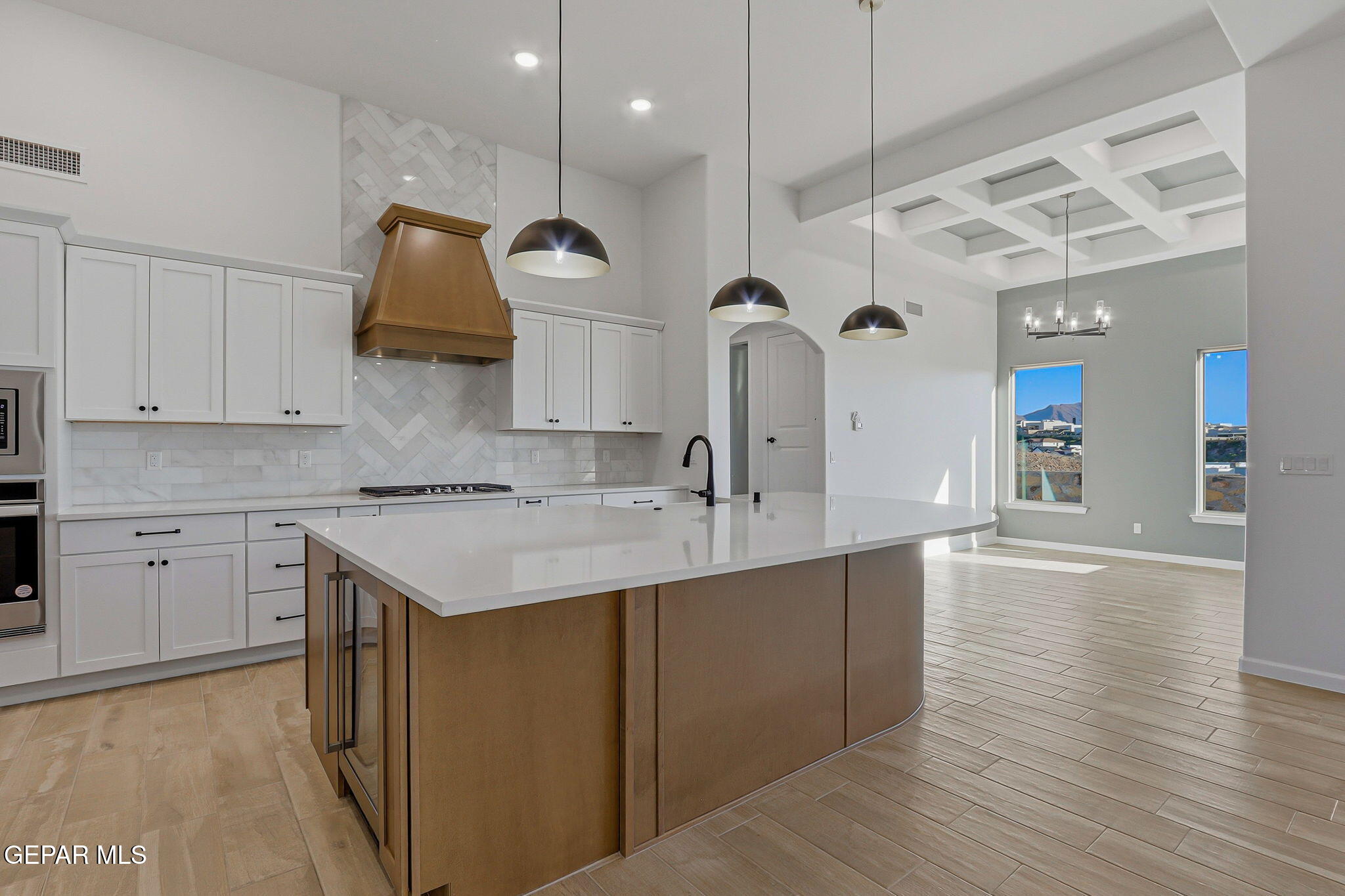 7416 Cimarron Rim Drive El Paso, TX 79911 - Photo 15 of 58 a kitchen with a sink cabinets and wooden floor