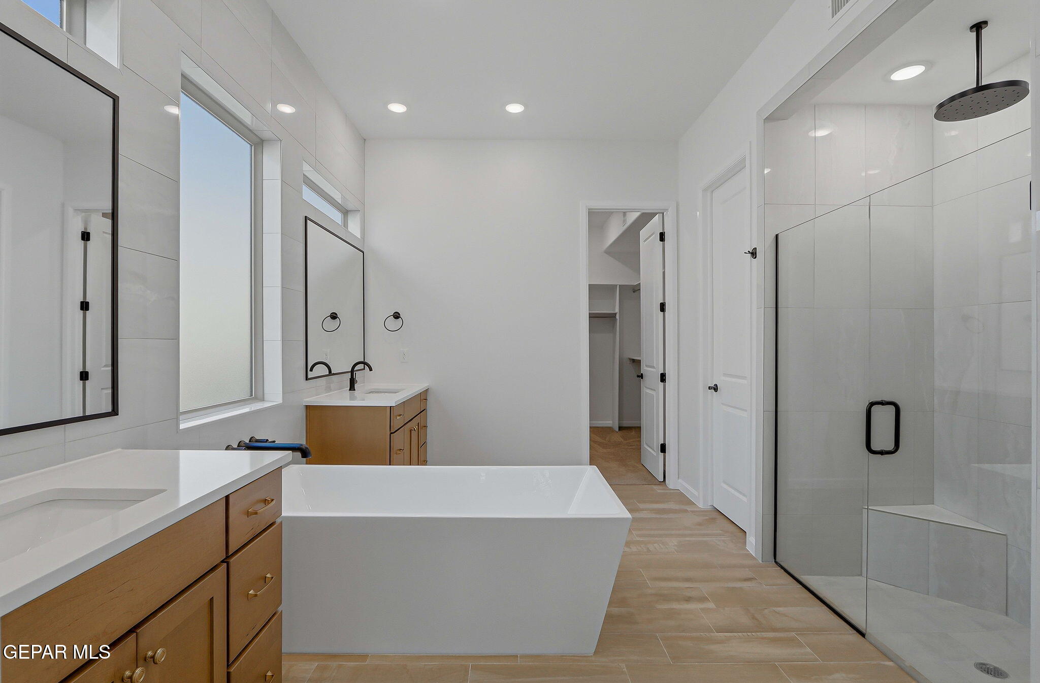 7416 Cimarron Rim Drive El Paso, TX 79911 - Photo 27 of 58 a spacious bathroom with a tub shower and sink