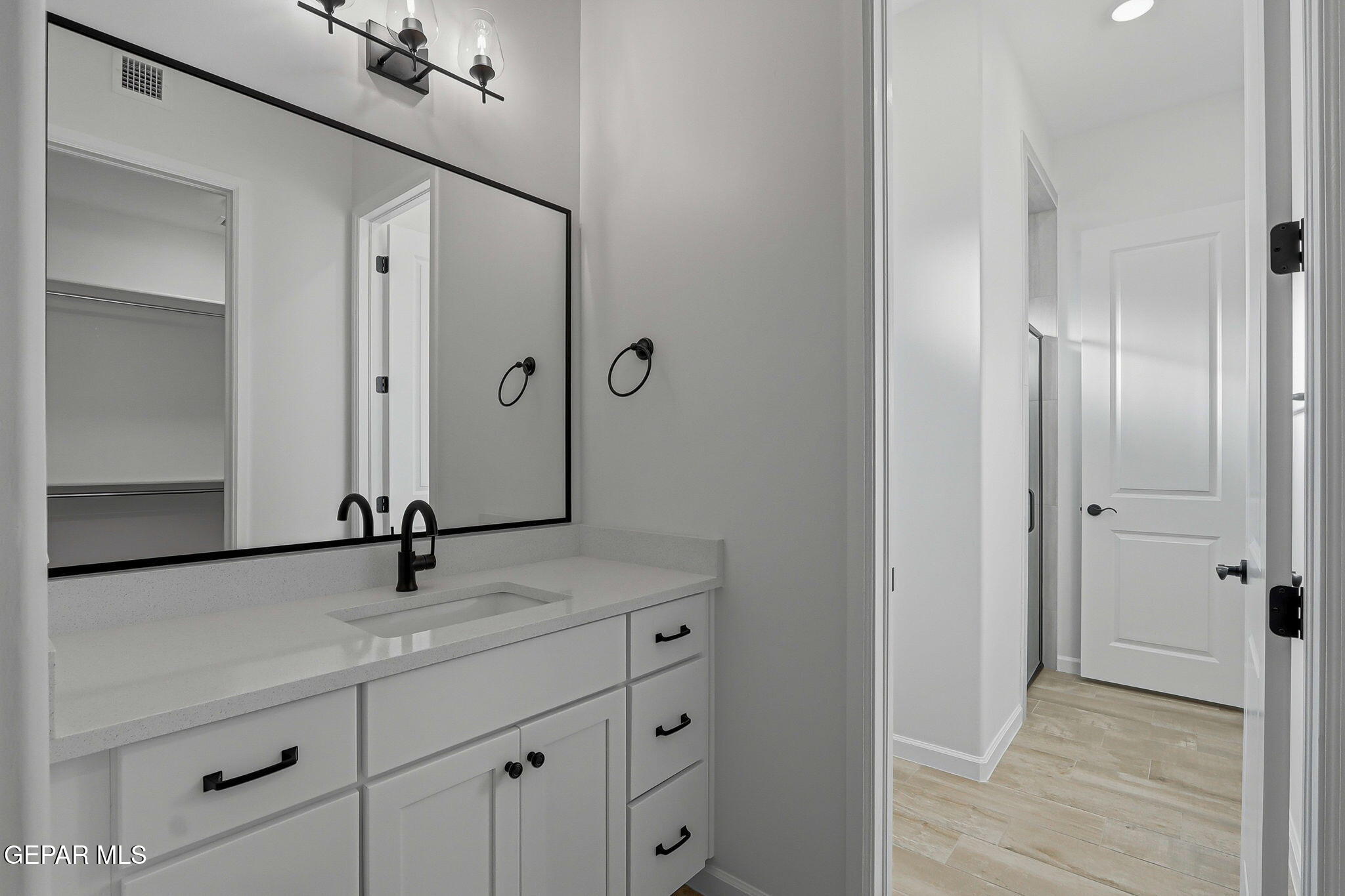 7416 Cimarron Rim Drive El Paso, TX 79911 - Photo 35 of 58 a bathroom with a sink and mirror