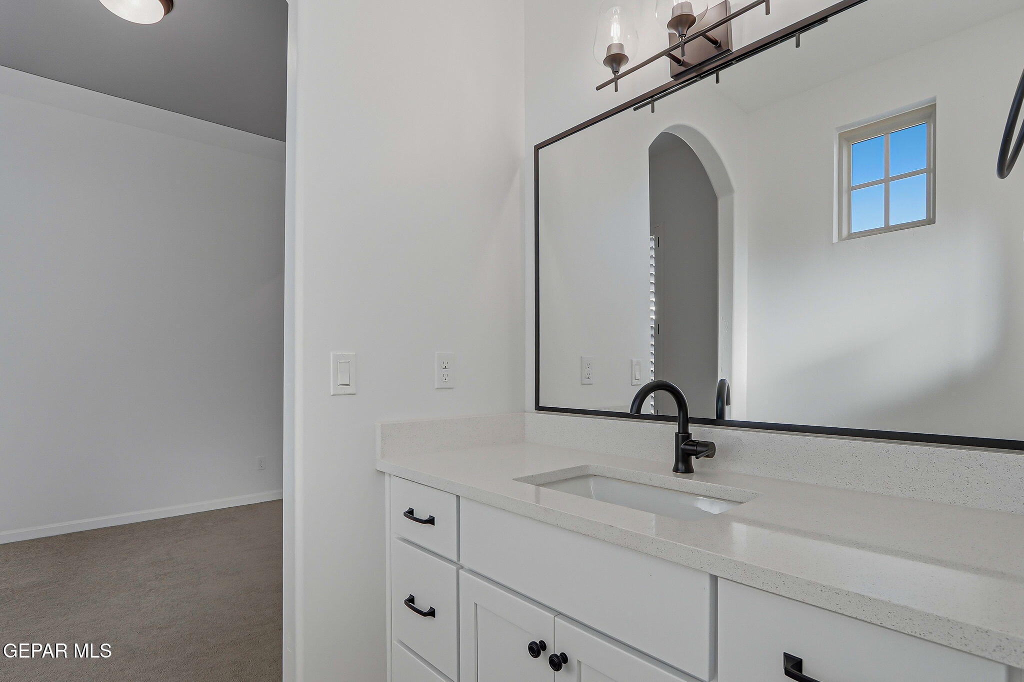 7416 Cimarron Rim Drive El Paso, TX 79911 - Photo 36 of 58 a bathroom with a sink and mirror