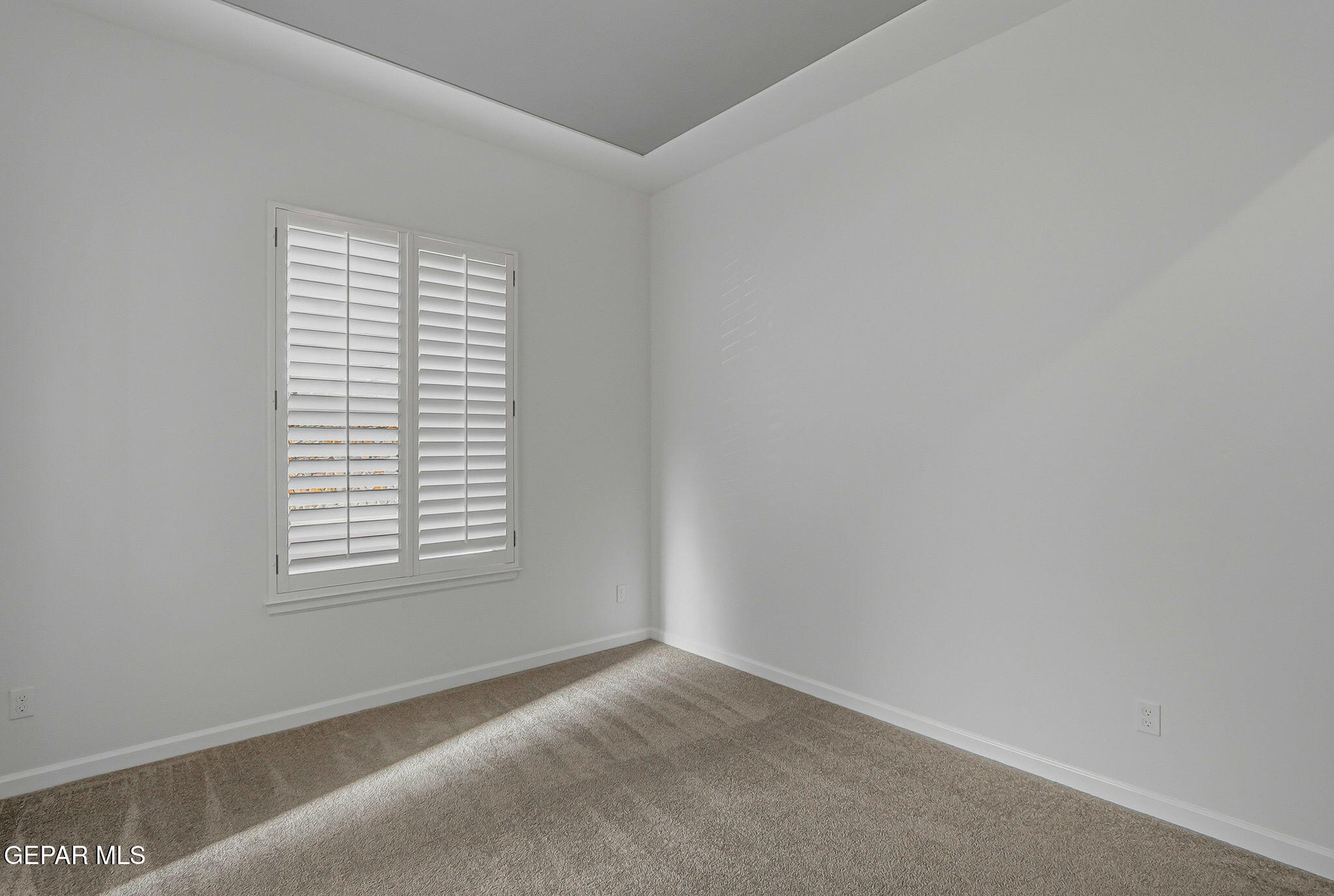 7416 Cimarron Rim Drive El Paso, TX 79911 - Photo 38 of 58 an empty room with a window