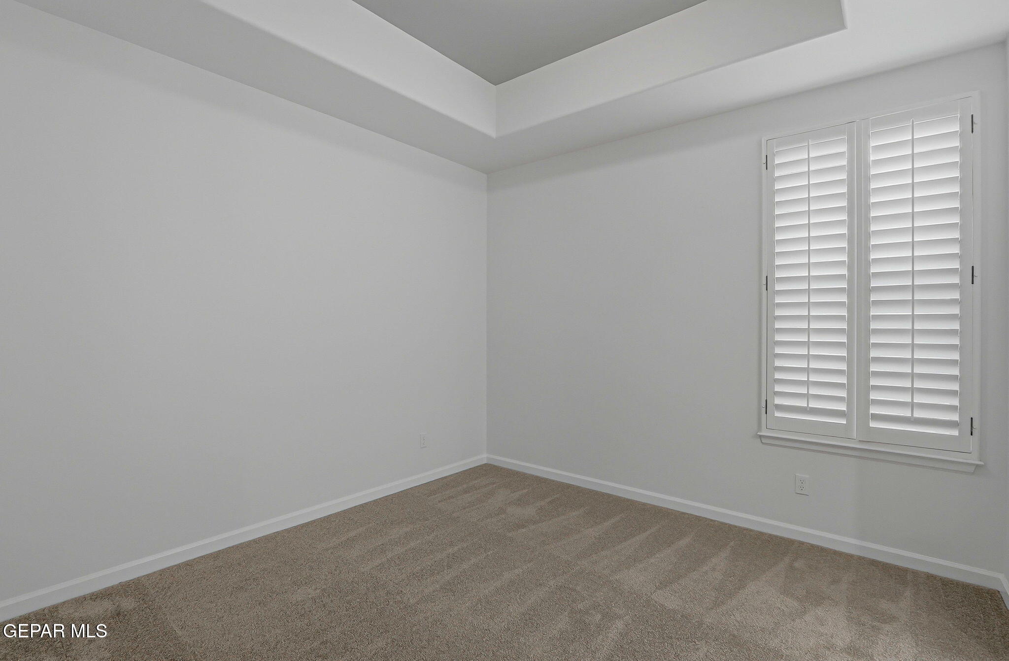 7416 Cimarron Rim Drive El Paso, TX 79911 - Photo 39 of 58 an empty room with a window