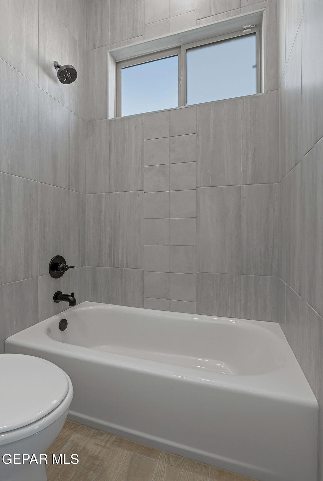 7416 Cimarron Rim Drive El Paso, TX 79911 - Photo 41 of 58 a bathroom with a bathtub and a toilet