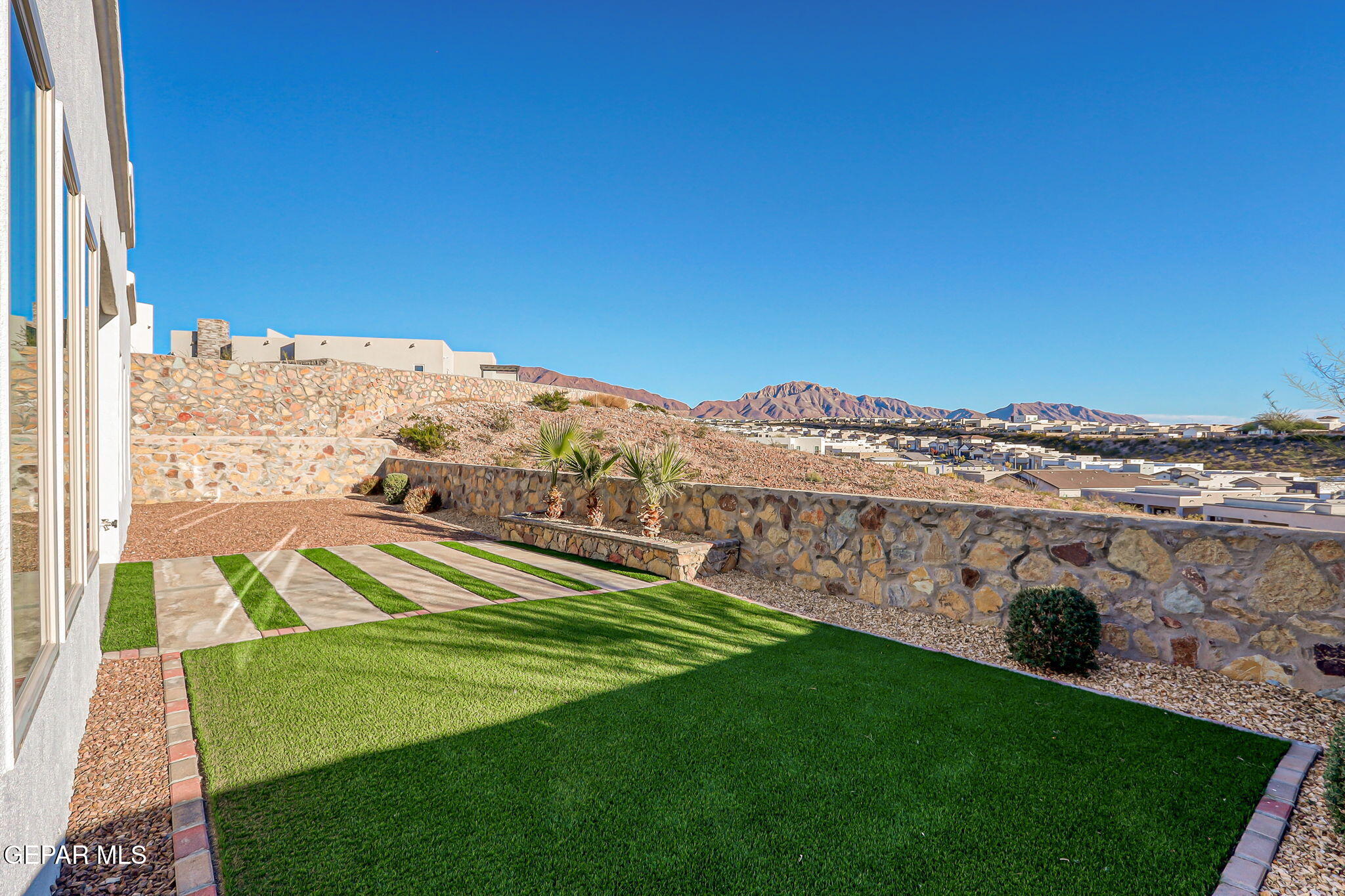 7416 Cimarron Rim Drive El Paso, TX 79911 - Photo 46 of 58 a view of an outdoor space and a yard
