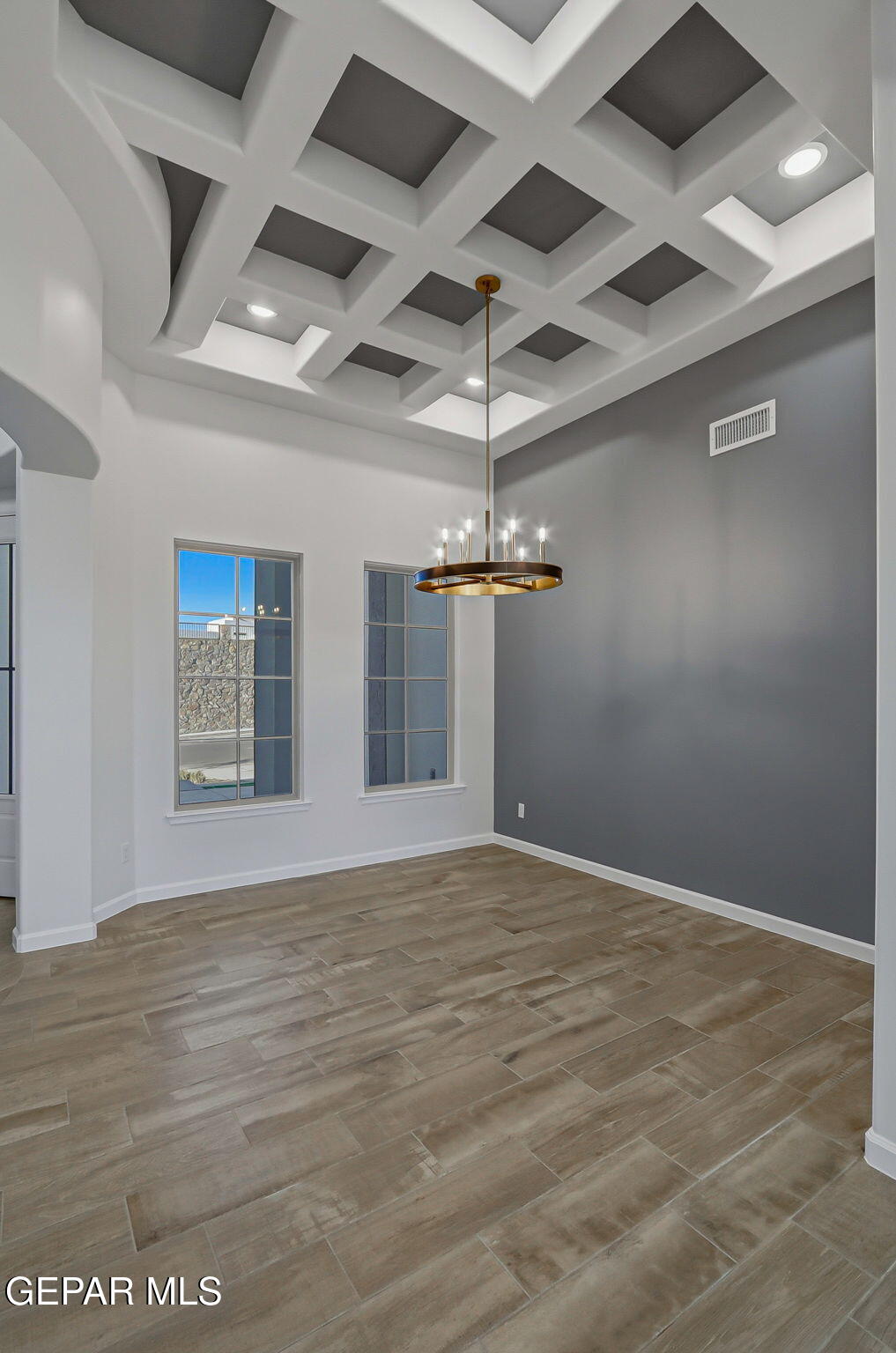 7416 Cimarron Rim Drive El Paso, TX 79911 - Photo 5 of 58 a view of an empty room with a chandelier
