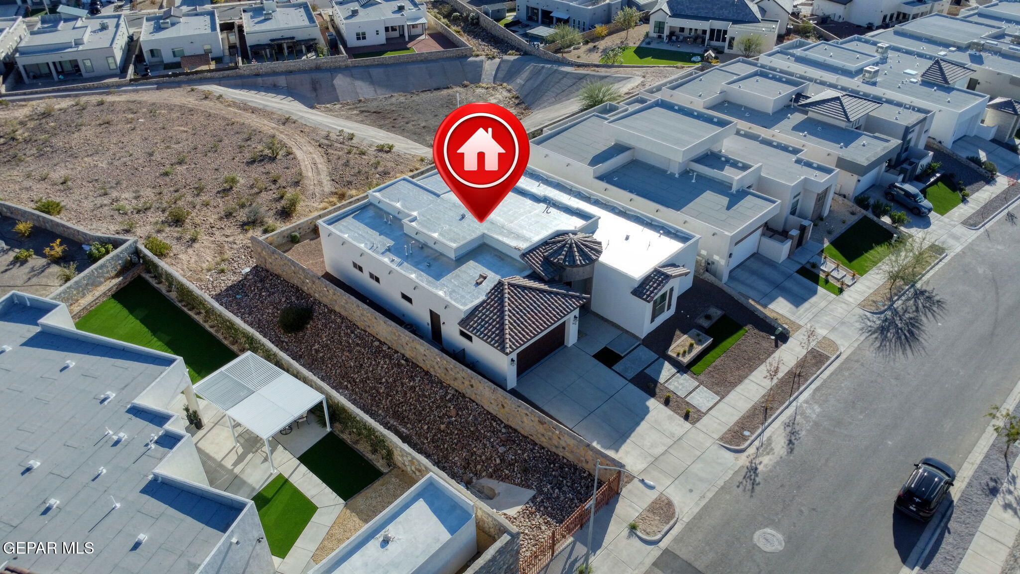 7416 Cimarron Rim Drive El Paso, TX 79911 - Photo 51 of 58 an aerial view of a house with a swimming pool