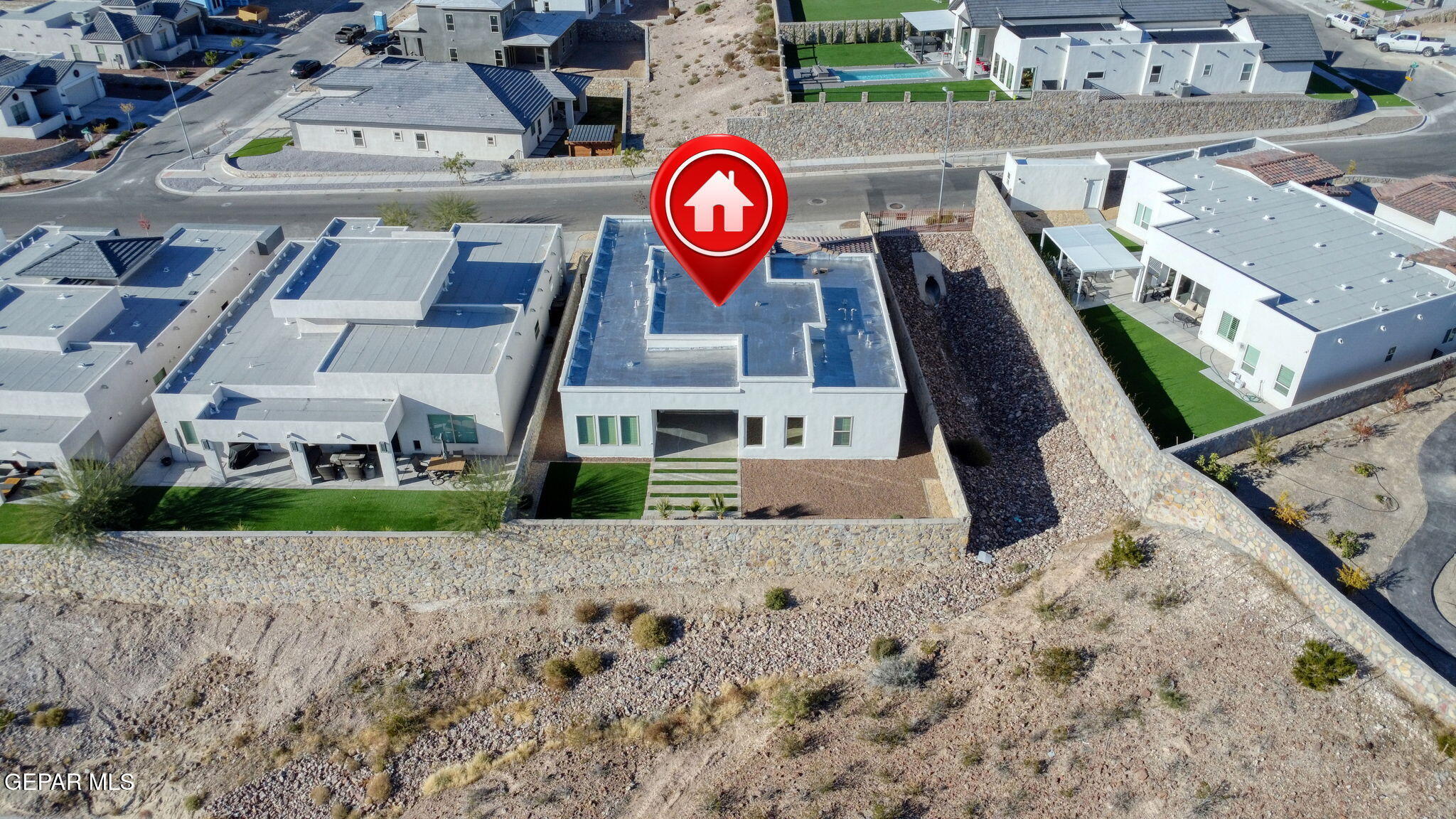 7416 Cimarron Rim Drive El Paso, TX 79911 - Photo 53 of 58 an aerial view of a house with a yard