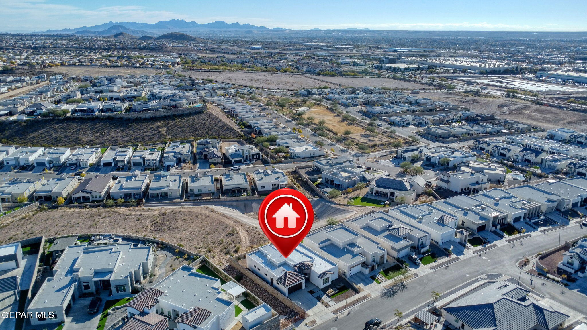 7416 Cimarron Rim Drive El Paso, TX 79911 - Photo 56 of 58 a view of a street with a building in the background