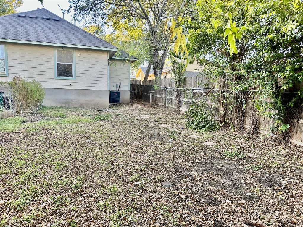 Undisclosed Address Austin, TX 78752 - Photo 15 of 15 a view of a house with a yard