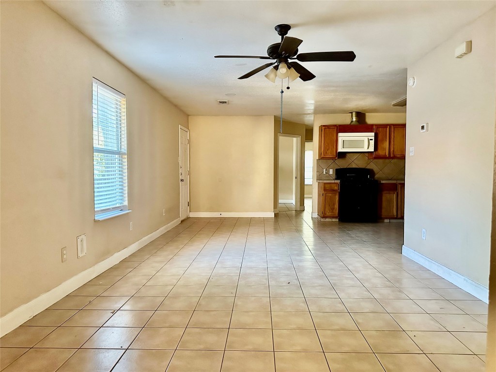 Undisclosed Address Austin, TX 78752 - Photo 2 of 15 a view of livingroom with hardwood floor and a ceiling fan