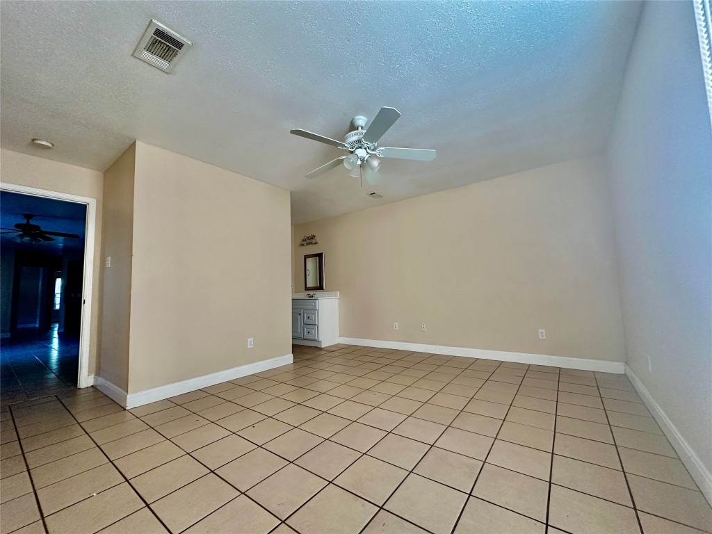 Undisclosed Address Austin, TX 78752 - Photo 7 of 15 a view of an empty room and chandelier fan