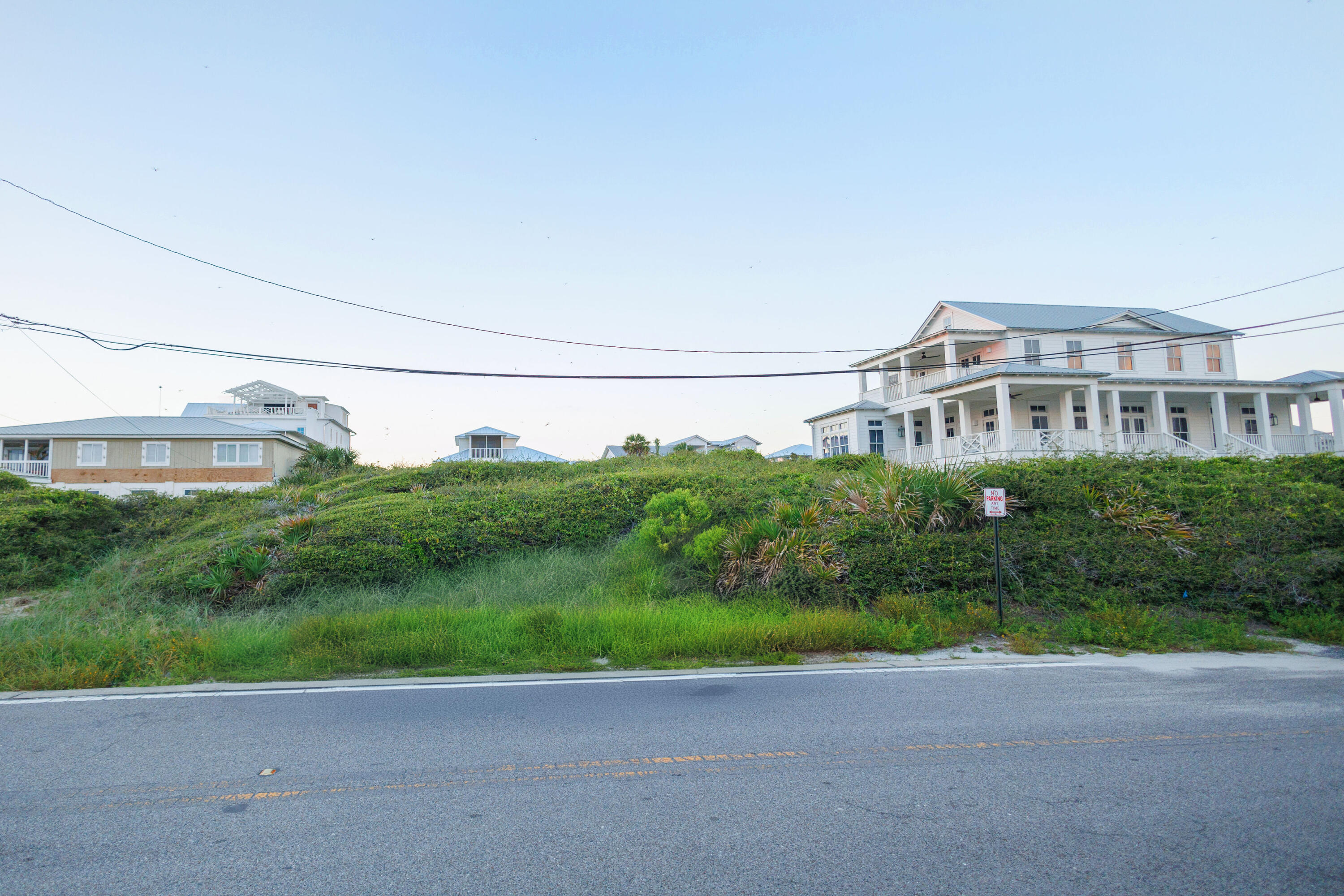 0 Pompano St Inlet Beach Inlet Beach, FL 32461 - Photo 13 of 14 a view of a big yard next to a building