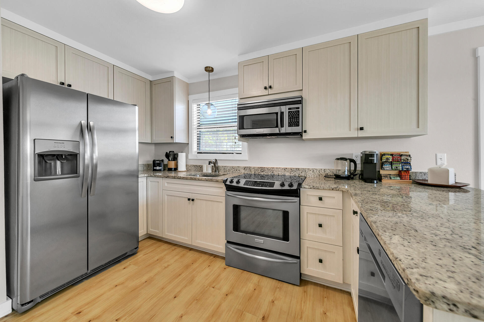 3799 East County Highway 30A, Unit H6 Santa Rosa Beach, FL 32459 - Photo 12 of 40 a kitchen with stainless steel appliances granite countertop a refrigerator sink and stove