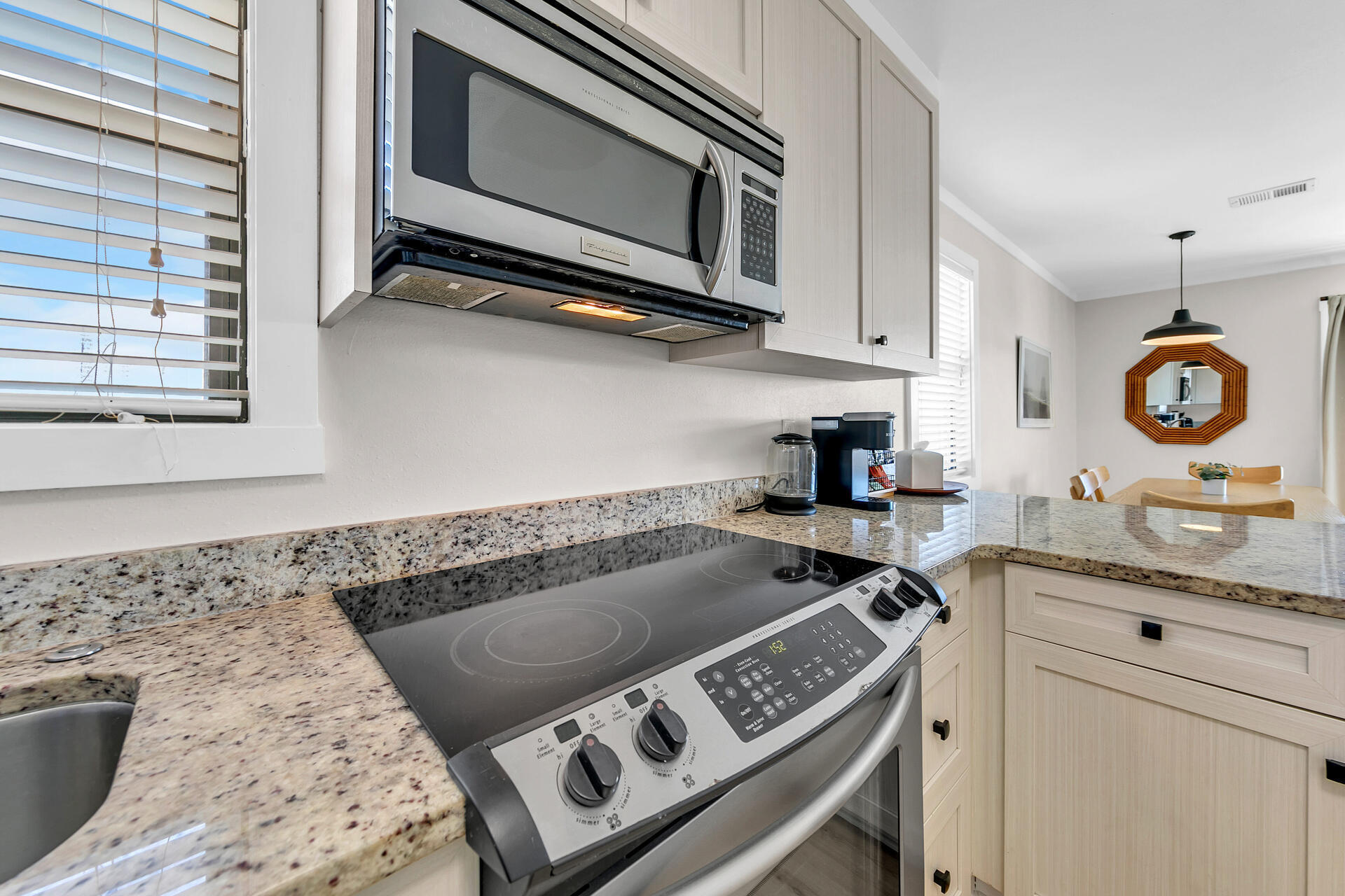 3799 East County Highway 30A, Unit H6 Santa Rosa Beach, FL 32459 - Photo 15 of 40 a kitchen with a stove and a microwave