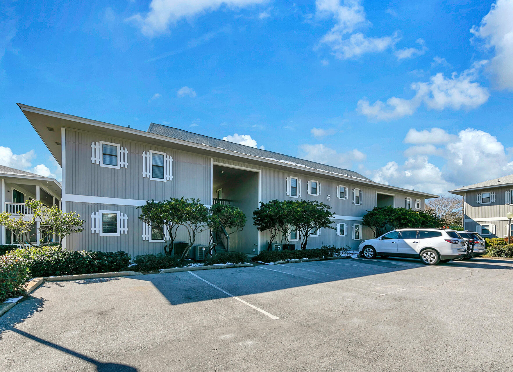 3799 East County Highway 30A, Unit H6 Santa Rosa Beach, FL 32459 - Photo 3 of 40 a front view of a house with garden