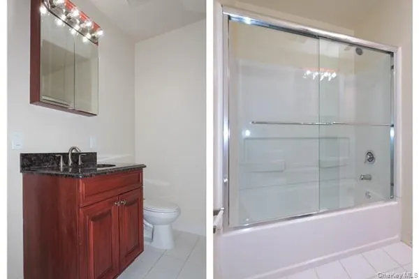a bathroom with a granite countertop sink a toilet and shower