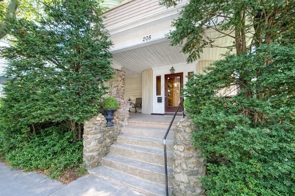 a view of a house with potted plants