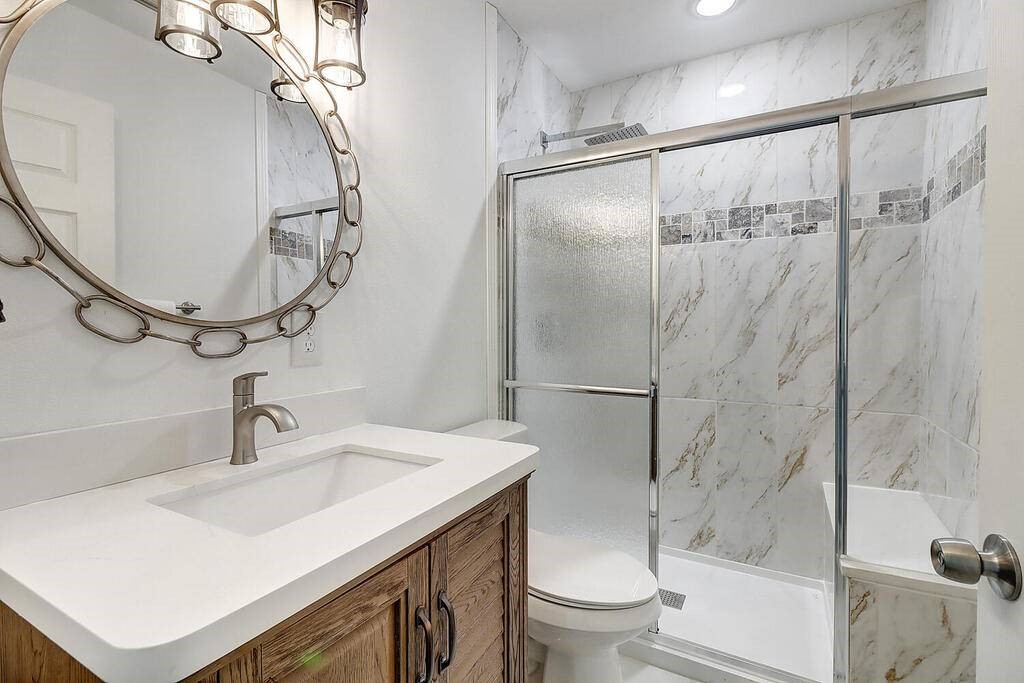 2445 Laguna Shores Road Corpus Christi, TX 78418 - Photo 16 of 39 a bathroom with a sink toilet and shower