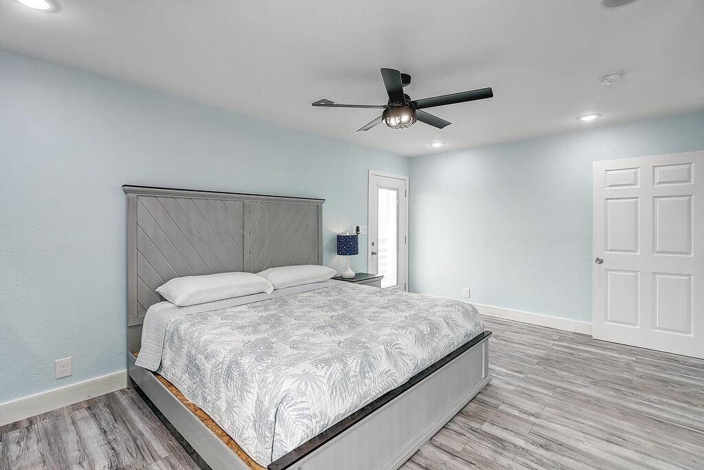 2445 Laguna Shores Road Corpus Christi, TX 78418 - Photo 19 of 39 a bedroom with a bed and a window