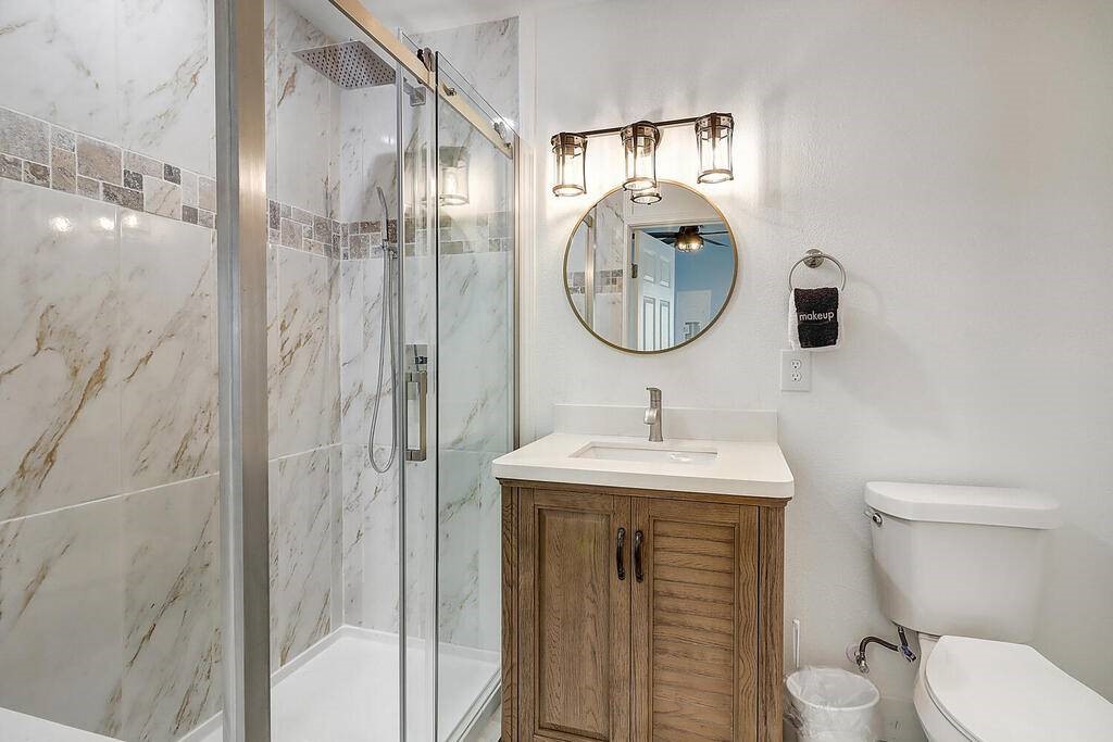 2445 Laguna Shores Road Corpus Christi, TX 78418 - Photo 22 of 39 a bathroom with a sink a toilet and shower