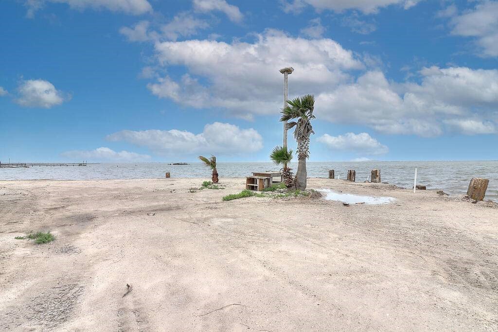 2445 Laguna Shores Road Corpus Christi, TX 78418 - Photo 36 of 39 a view of a dry yard with wooden fence