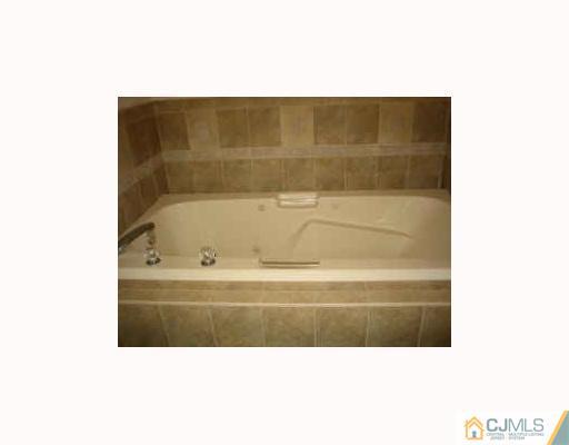 32 Inverness Drive Edison, NJ 08820 - Photo 9 of 9 a bathroom with a bathtub and a shower
