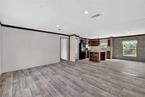 a view of a livingroom with wooden floor