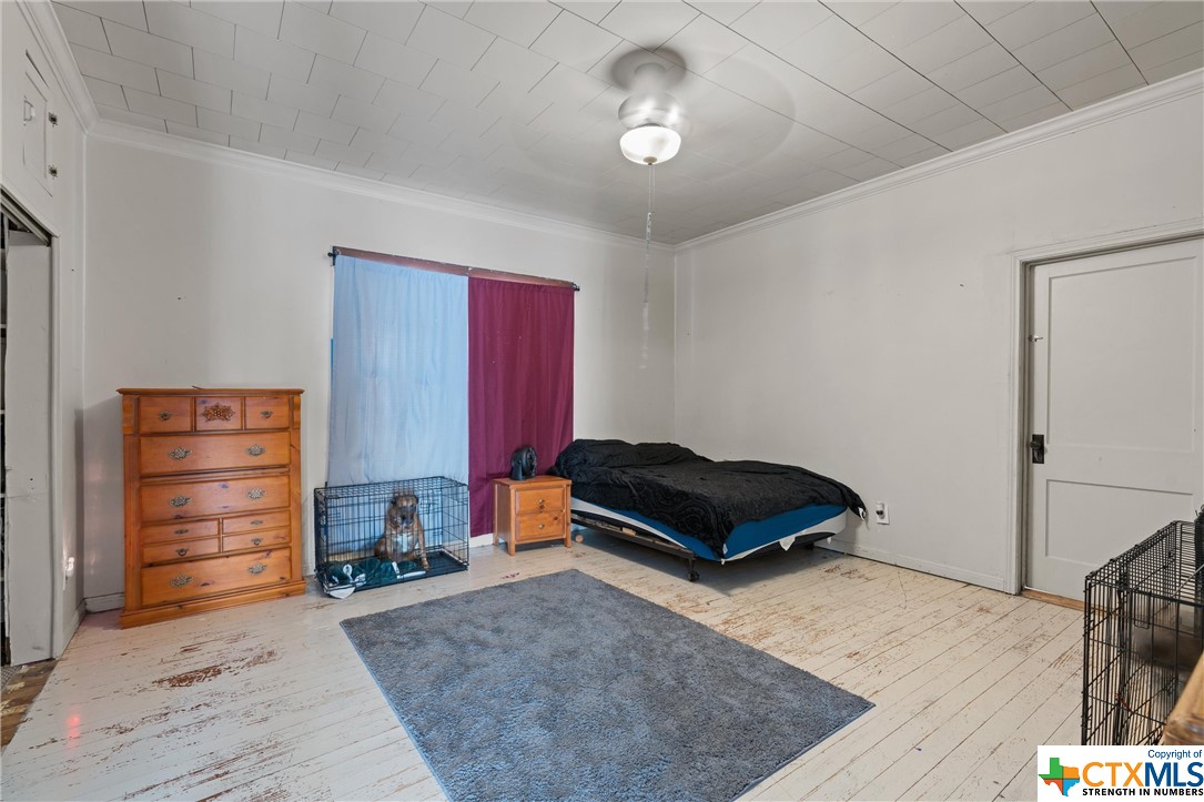 459 County Road 450 Thorndale, TX 76577 - Photo 22 of 34 a bedroom with a bed and a dresser