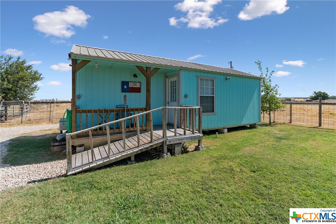 459 County Road 450 Thorndale, TX 76577 - Photo 25 of 34 a view of a house with backyard and sitting area