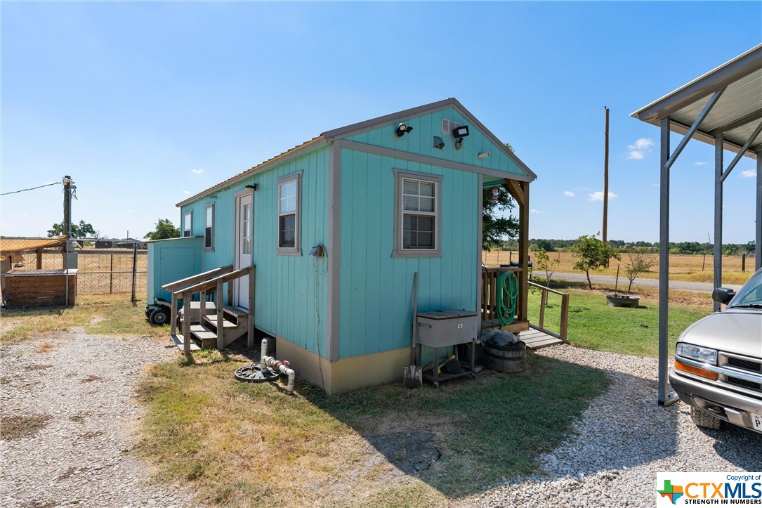 459 County Road 450 Thorndale, TX 76577 - Photo 26 of 34 a view of a chair and table in the patio