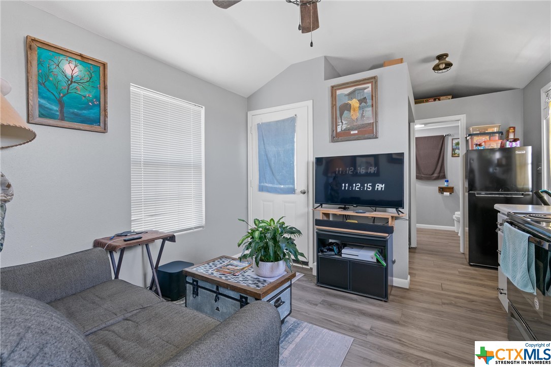 459 County Road 450 Thorndale, TX 76577 - Photo 29 of 34 a living room with furniture a flat screen tv and a fireplace