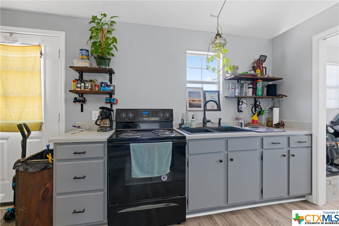459 County Road 450 Thorndale, TX 76577 - Photo 30 of 34 a kitchen with stainless steel appliances granite countertop a stove and a sink