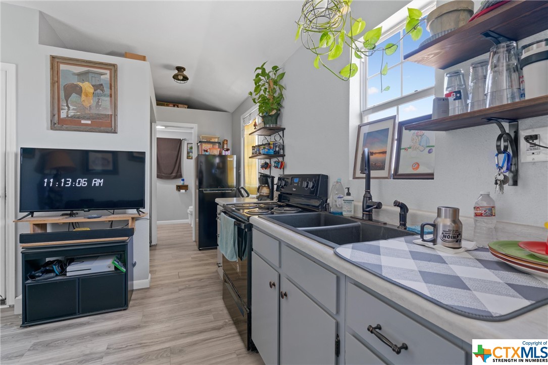 459 County Road 450 Thorndale, TX 76577 - Photo 32 of 34 a kitchen with a sink appliances and cabinets
