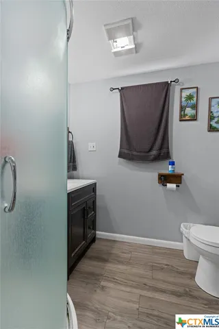 a bathroom with a toilet and a sink