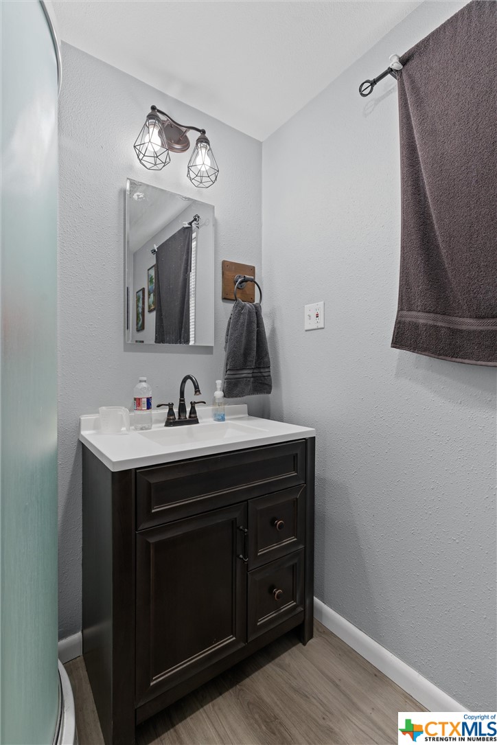 459 County Road 450 Thorndale, TX 76577 - Photo 34 of 34 a bathroom with a sink and a mirror