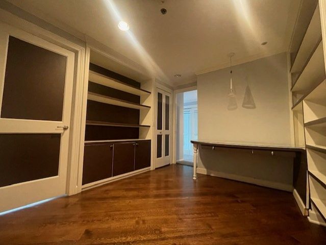 a view of an empty room with a closet