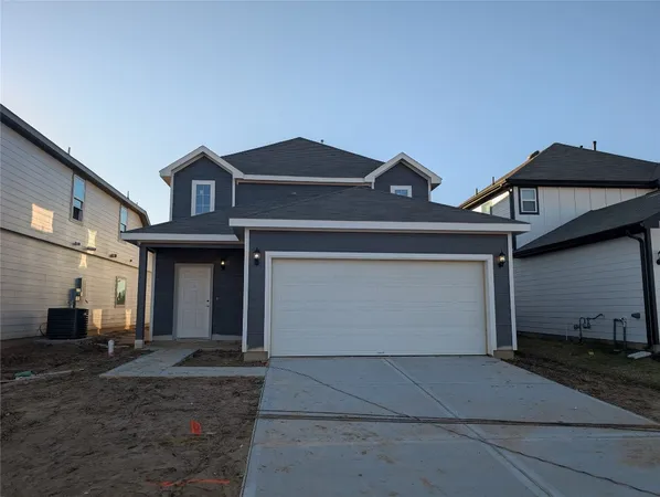 a front view of a house with garage
