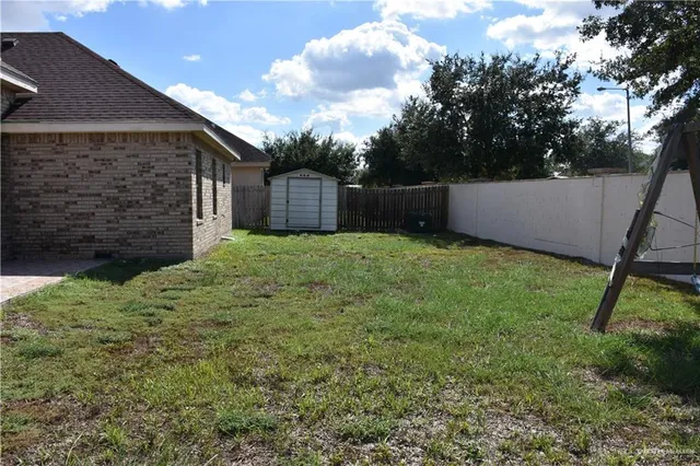 an aerial view of house with yard